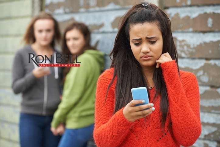 teenage-girl-being-bullied-by-text-message