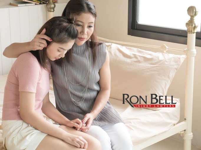 mother-comforting-her-sad-teenage-daughter