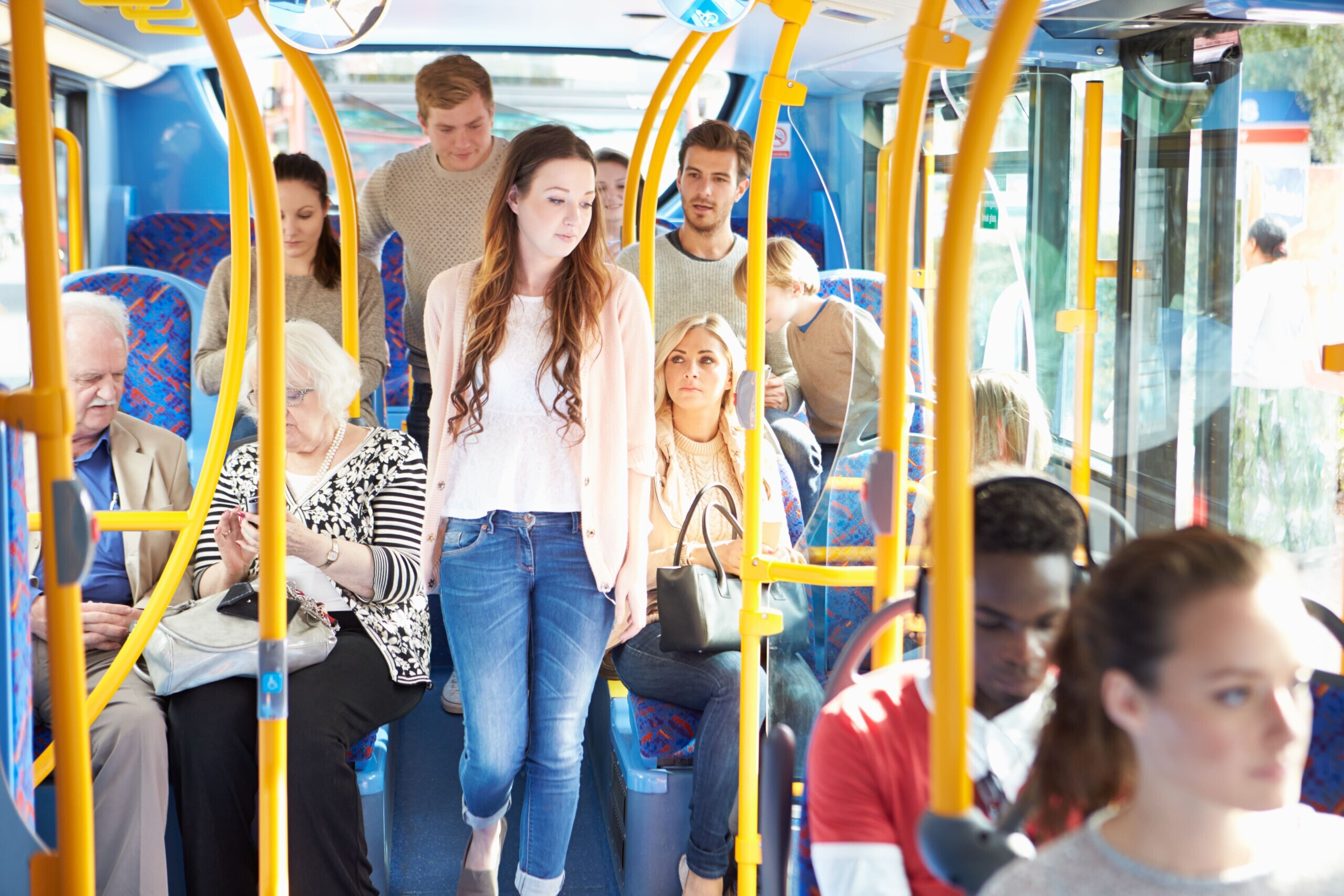 Interior,Of,Bus,With,Passengers people on a bus