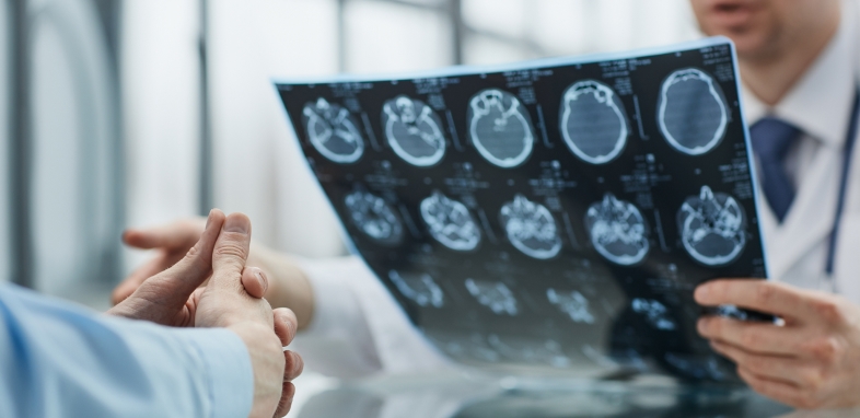 1.8 Brain Injury doctor examining brain scan results