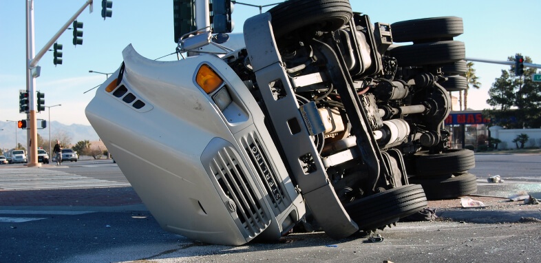 Truck-Accidents large truck tipped over in road intersection