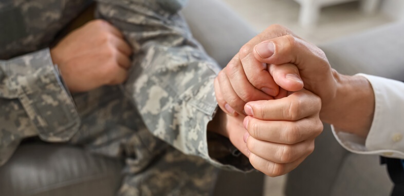 Veterans-Benefits veteran holding hands with someone close up